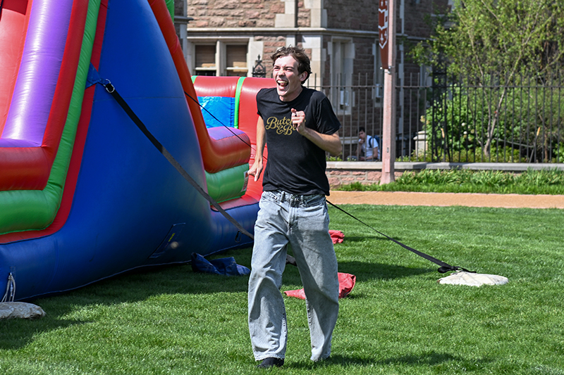 student walking across campus