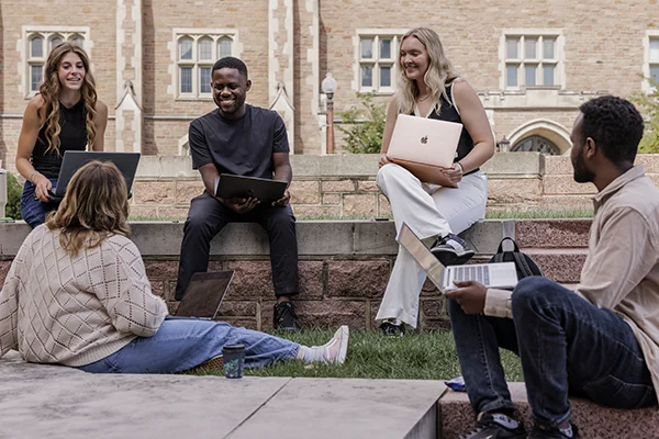 Brown School students studying out on the Quad